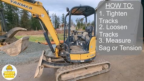 how to put the track back on a mini excavator|track tension for mini excavators.